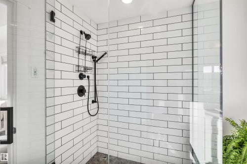 Full bath featuring a stall shower - 11 Promenade Point(E), Beaumont, AB - Indoor Photo Showing Bathroom