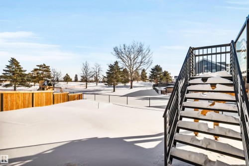 Snowy yard with stairs - 11 Promenade Point(E), Beaumont, AB - Outdoor