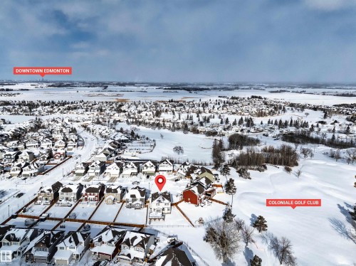 Snowy aerial view with a residential view - 11 Promenade Point(E), Beaumont, AB - Outdoor With View