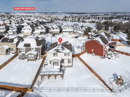 Snowy aerial view featuring a residential view - 11 Promenade Point(E), Beaumont, AB - Outdoor