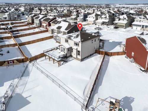 Snowy aerial view featuring a residential view - 11 Promenade Point(E), Beaumont, AB - Outdoor