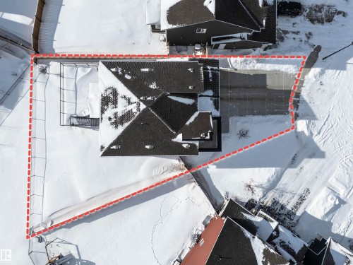 Snowy aerial view featuring property parcel outlined - 11 Promenade Point(E), Beaumont, AB - 