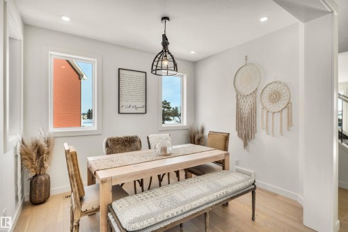 Dining space featuring light wood-type flooring and recessed lighting - 11 Promenade Point(E), Beaumont, AB - Indoor Photo Showing Dining Room