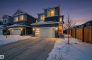 Contemporary house featuring stone siding, a garage, and concrete driveway - 3224 160 Street, Edmonton, AB  - Outdoor With Facade 