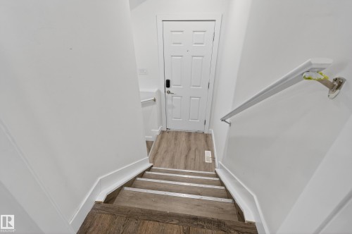 Stairway featuring wood finished floors - 3224 160 Street, Edmonton, AB - Indoor Photo Showing Other Room