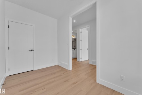 Unfurnished bedroom featuring recessed lighting and light wood-style flooring - 6111 Crawford Drive, Edmonton, AB - Indoor Photo Showing Other Room