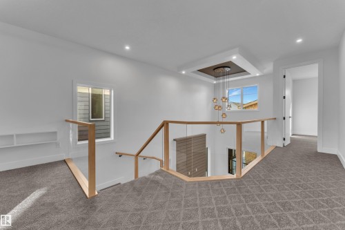 Hall with an upstairs landing, carpet, a raised ceiling, and recessed lighting - 6111 Crawford Drive, Edmonton, AB - Indoor Photo Showing Other Room