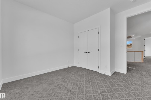 Unfurnished bedroom featuring carpet floors and a closet - 6111 Crawford Drive, Edmonton, AB - Indoor Photo Showing Other Room