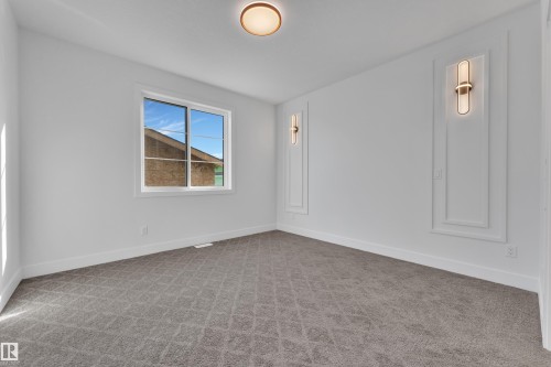 Unfurnished room with light colored carpet and baseboards - 6111 Crawford Drive, Edmonton, AB - Indoor Photo Showing Other Room