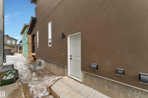 View of home's exterior featuring stucco siding - 6111 Crawford Drive, Edmonton, AB - Outdoor With Exterior