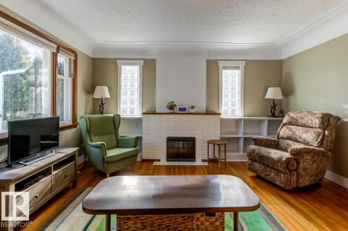 10714 128 Street, Edmonton, AB - Indoor Photo Showing Living Room With Fireplace