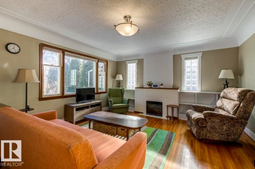 10714 128 Street, Edmonton, AB - Indoor Photo Showing Living Room With Fireplace