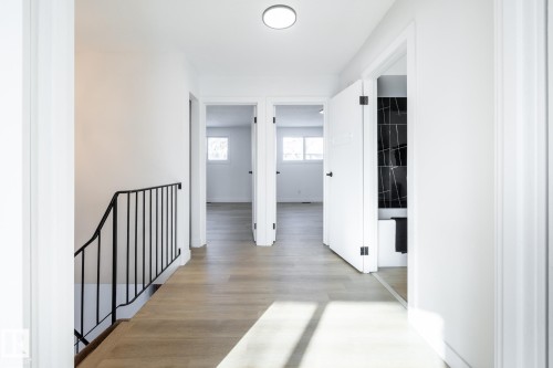 Hallway featuring light wood finished floors and an upstairs landing - 13449 40 Street, Edmonton, AB - Indoor Photo Showing Other Room