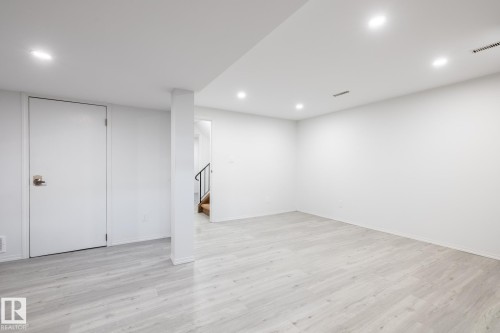 Finished basement featuring light wood-style floors and recessed lighting - 13449 40 Street, Edmonton, AB - Indoor