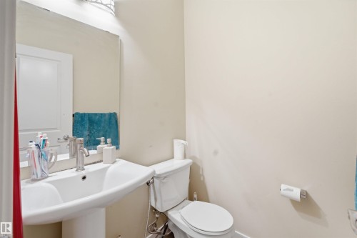 Half bathroom with toilet and a sink - 2923 16 Street, Edmonton, AB - Indoor Photo Showing Bathroom