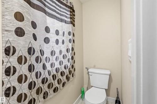 Bathroom featuring toilet and a shower - 2923 16 Street, Edmonton, AB - Indoor Photo Showing Bathroom