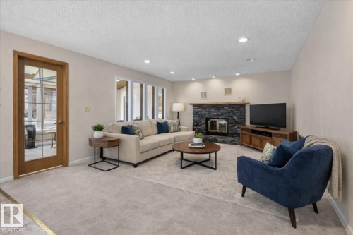 470 Rooney Crescent, Edmonton, AB - Indoor Photo Showing Living Room With Fireplace