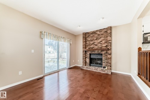 1923 52 Street Nw, Edmonton, AB - Indoor Photo Showing Living Room With Fireplace