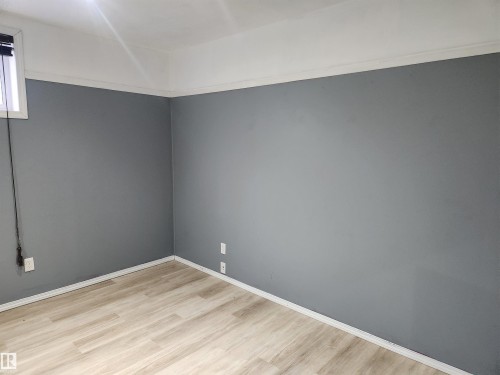 Unfurnished room with light wood-type flooring and baseboards - 14076 152 Avenue, Edmonton, AB - Indoor Photo Showing Other Room