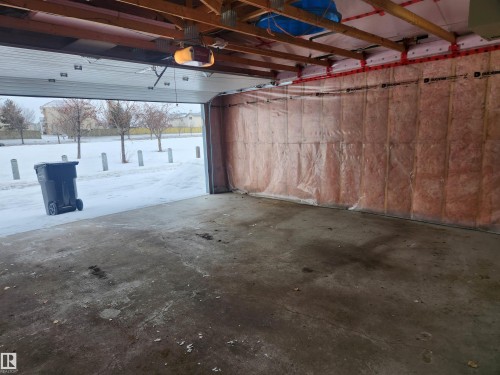 Garage featuring a garage door opener - 14076 152 Avenue, Edmonton, AB - Indoor Photo Showing Garage
