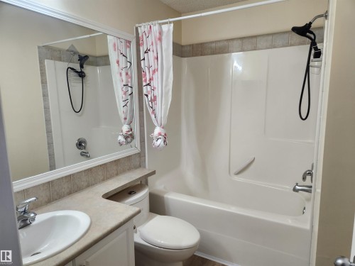 Bathroom with shower / tub combo with curtain and vanity - 14076 152 Avenue, Edmonton, AB - Indoor Photo Showing Bathroom
