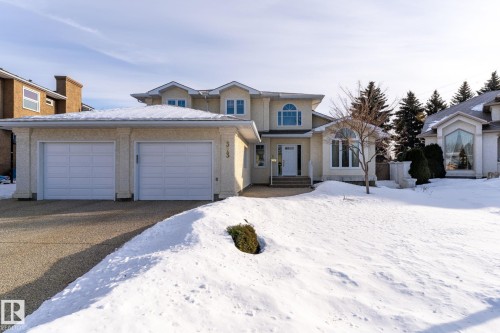Traditional home with an attached garage and driveway - 313 Hedley Way, Edmonton, AB - Outdoor With Facade