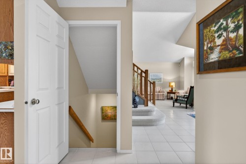 Staircase featuring tile patterned flooring - 313 Hedley Way, Edmonton, AB - Indoor Photo Showing Other Room