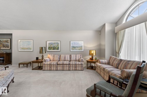 Carpeted living area with a textured ceiling - 313 Hedley Way, Edmonton, AB - Indoor Photo Showing Living Room