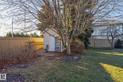 Fenced backyard featuring a storage unit - 313 Hedley Way, Edmonton, AB - Outdoor