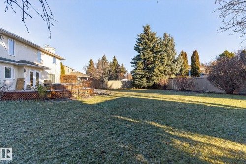 Fenced backyard featuring a wooden deck and french doors - 313 Hedley Way, Edmonton, AB - Outdoor