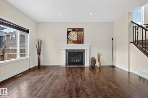 7915 18 Ave, Edmonton, AB - Indoor Photo Showing Living Room With Fireplace
