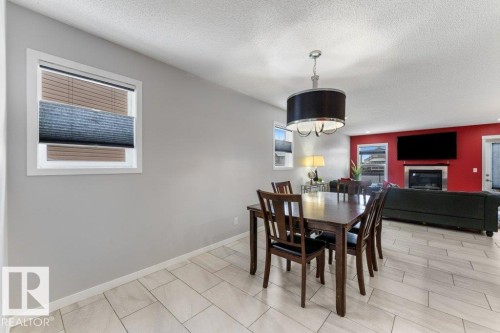5254 20 Avenue, Edmonton, AB - Indoor Photo Showing Dining Room With Fireplace
