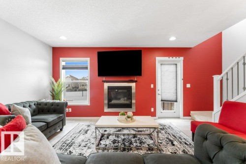 5254 20 Avenue, Edmonton, AB - Indoor Photo Showing Living Room With Fireplace