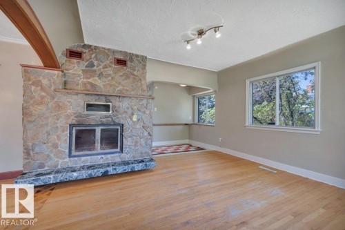 10148 87 Street, Edmonton, AB - Indoor Photo Showing Living Room With Fireplace