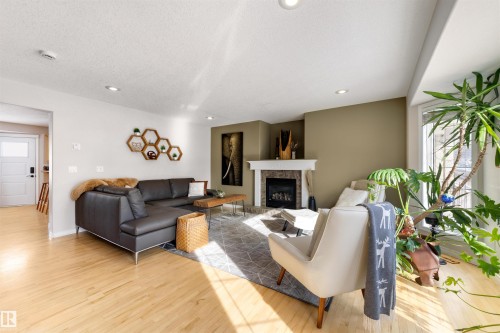 8818 Rowland Road, Edmonton, AB - Indoor Photo Showing Living Room With Fireplace