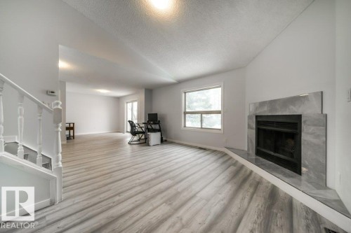 1877 Mill Woods Road E, Edmonton, AB - Indoor Photo Showing Living Room With Fireplace