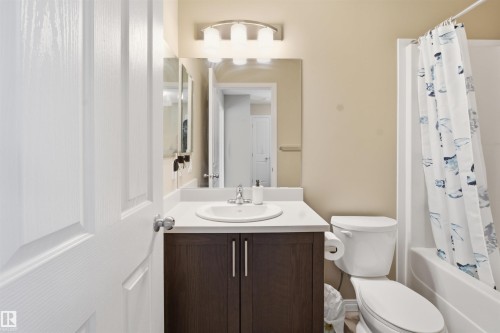 Bathroom with vanity and shower / bath combo with shower curtain - 48 1140 Chappelle Boulevard, Edmonton, AB - Indoor Photo Showing Bathroom