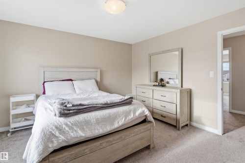 Bedroom with light carpet - 48 1140 Chappelle Boulevard, Edmonton, AB - Indoor Photo Showing Bedroom
