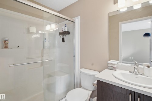 Bathroom with vanity and a stall shower - 48 1140 Chappelle Boulevard, Edmonton, AB - Indoor Photo Showing Bathroom