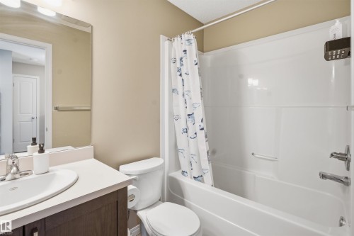 Full bathroom featuring vanity and shower / tub combo - 48 1140 Chappelle Boulevard, Edmonton, AB - Indoor Photo Showing Bathroom