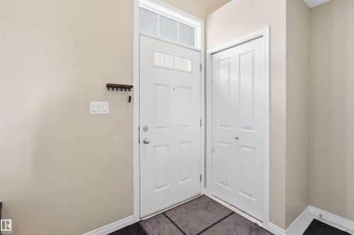 Foyer with baseboards - 48 1140 Chappelle Boulevard, Edmonton, AB - Indoor Photo Showing Other Room