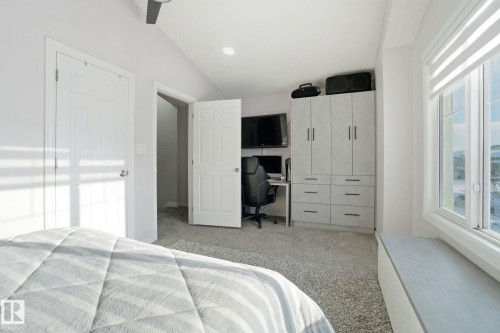 Bedroom featuring vaulted ceiling, a desk, and light colored carpet - 1532 37C Avenue, Edmonton, AB - Indoor Photo Showing Bedroom
