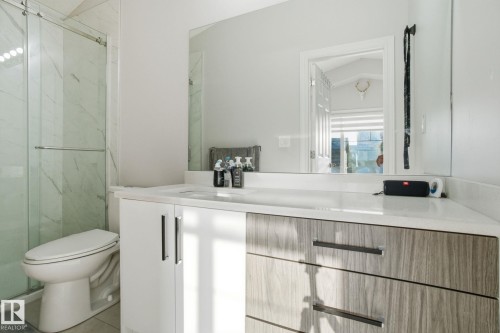 Bathroom with vanity and a marble finish shower - 1532 37C Avenue, Edmonton, AB - Indoor Photo Showing Bathroom