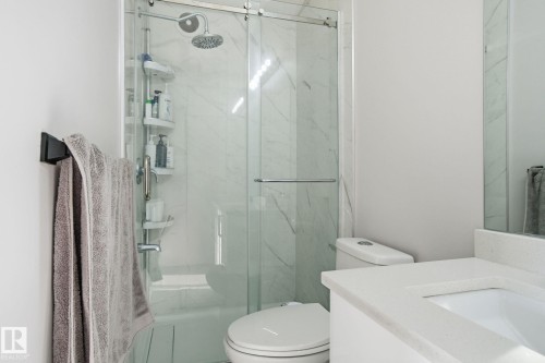Full bathroom with vanity and a marble finish shower - 1532 37C Avenue, Edmonton, AB - Indoor Photo Showing Bathroom