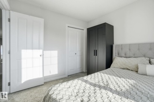 Carpeted bedroom featuring a closet and baseboards - 1532 37C Avenue, Edmonton, AB - Indoor Photo Showing Bedroom