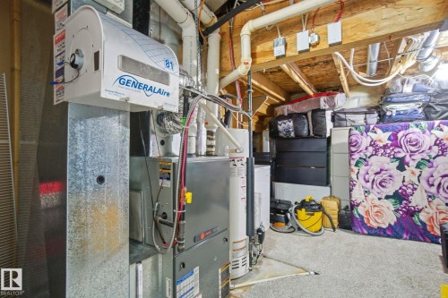 Utility room with heating unit and water heater - 1532 37C Avenue, Edmonton, AB - Indoor Photo Showing Basement