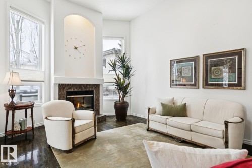 22 Prestige Point(E), Edmonton, AB - Indoor Photo Showing Living Room With Fireplace