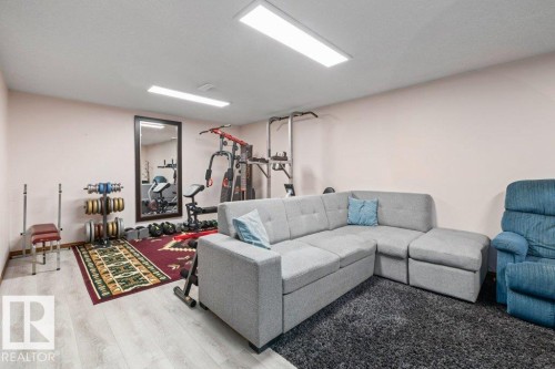 Living room with light wood-type flooring - 1 Larkspur Crescent, St. Albert, AB - Indoor