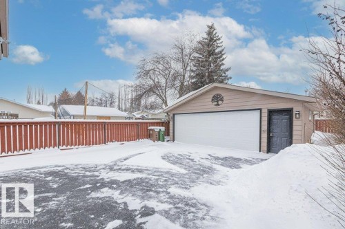 Snow covered garage featuring a garage - 1 Larkspur Crescent, St. Albert, AB - Outdoor