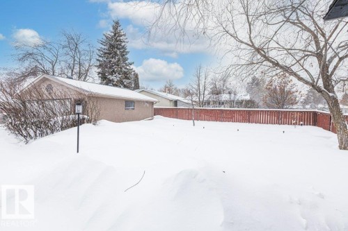 View of snow covered exterior featuring brick siding - 1 Larkspur Crescent, St. Albert, AB - Outdoor
